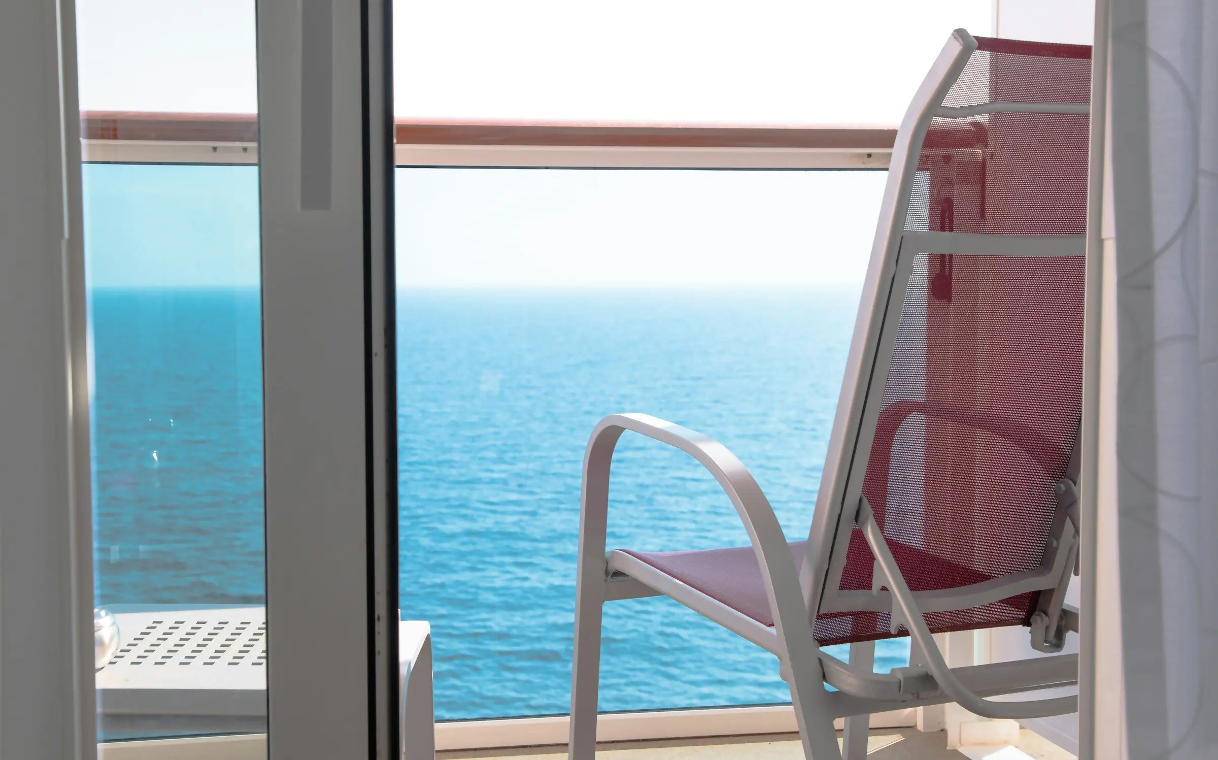 An open balcony slider looking out over the ocean