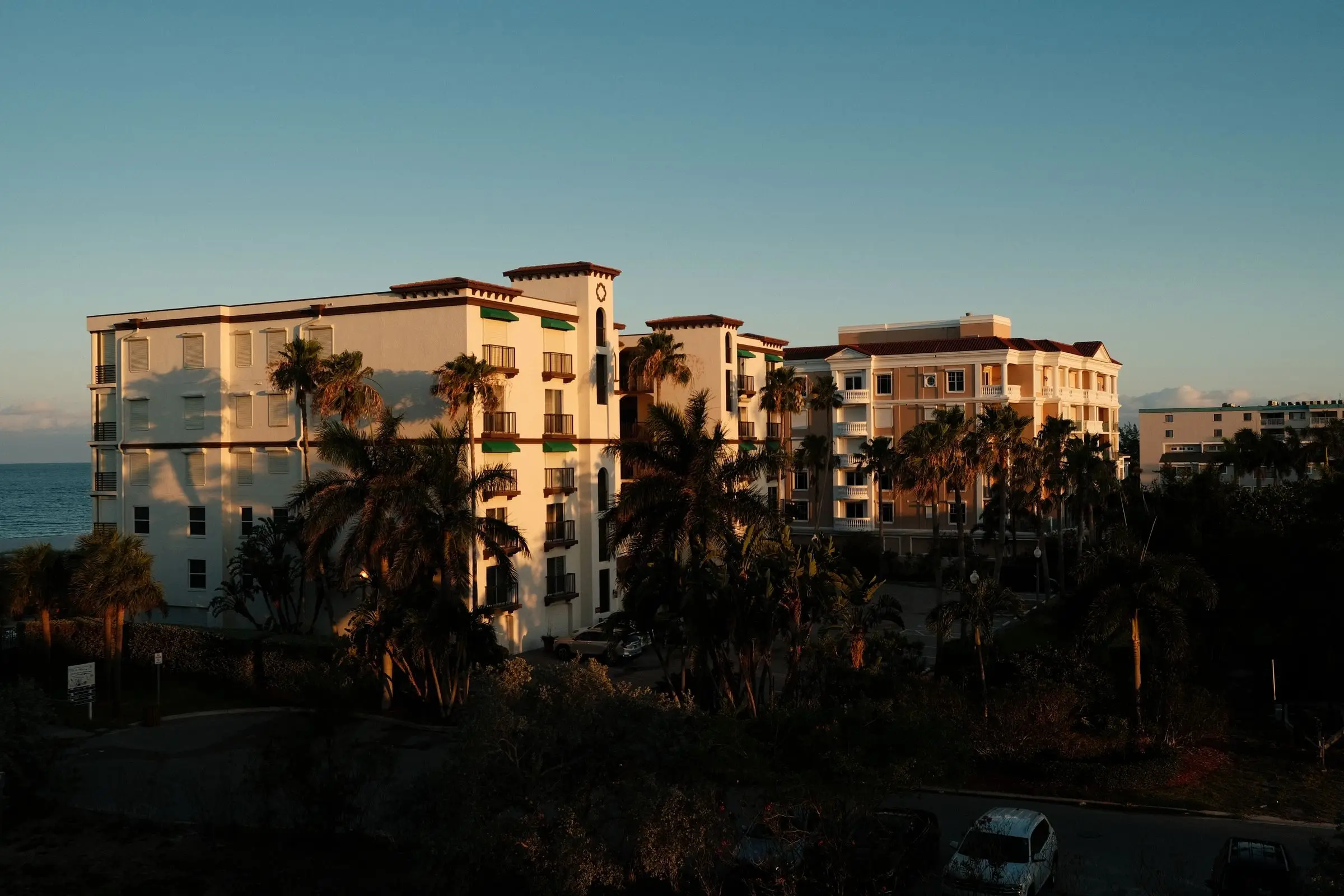 A coastal condo building with balconies