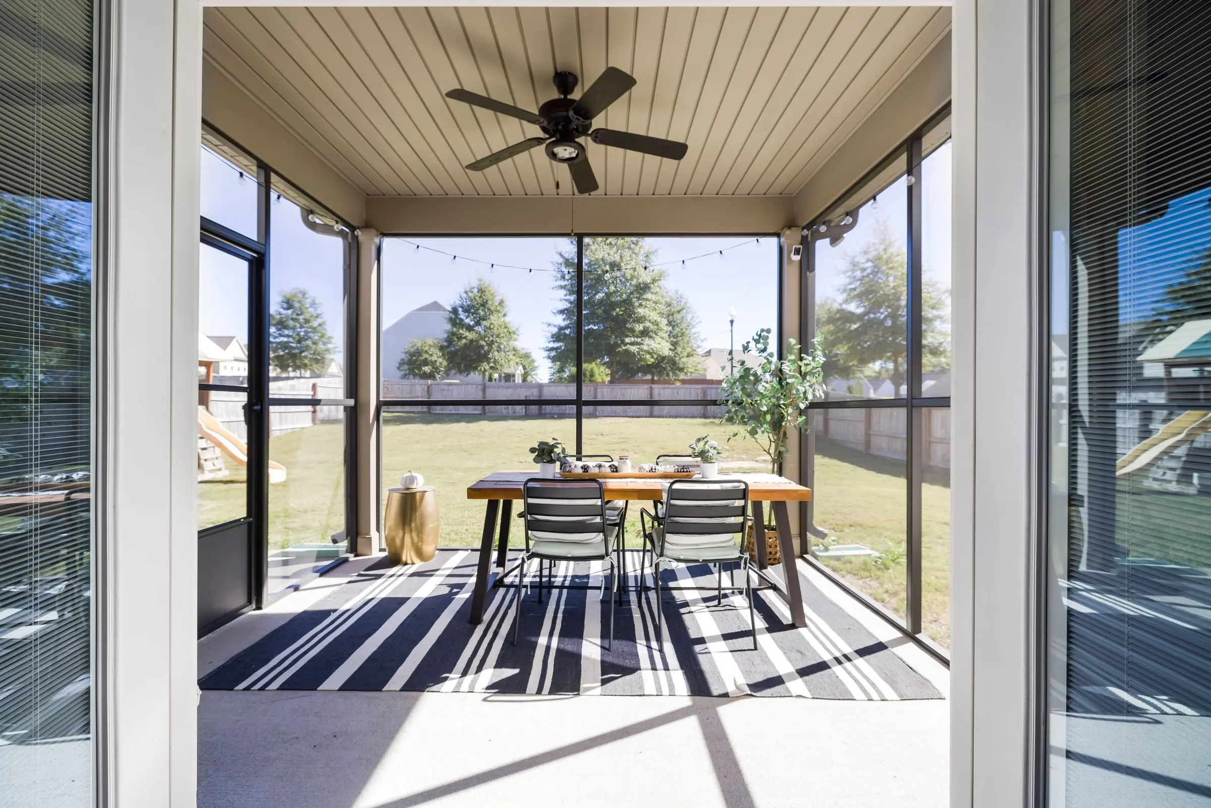 A sliding screen door on a patio